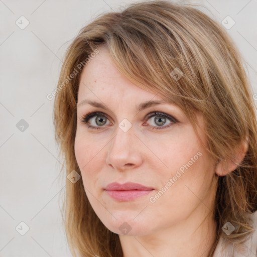 Joyful white adult female with medium  brown hair and blue eyes