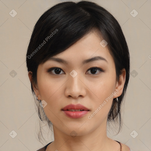 Joyful asian young-adult female with medium  black hair and brown eyes