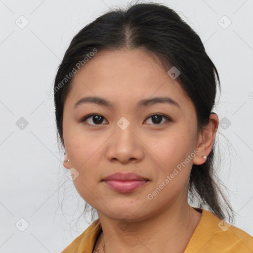 Joyful asian young-adult female with medium  brown hair and brown eyes