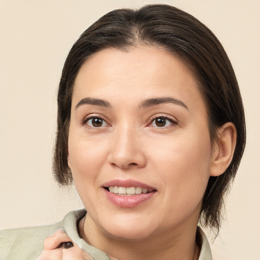 Joyful white young-adult female with medium  brown hair and brown eyes