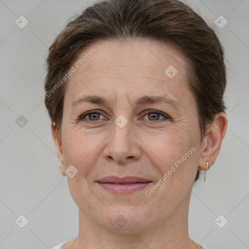 Joyful white adult female with short  brown hair and brown eyes