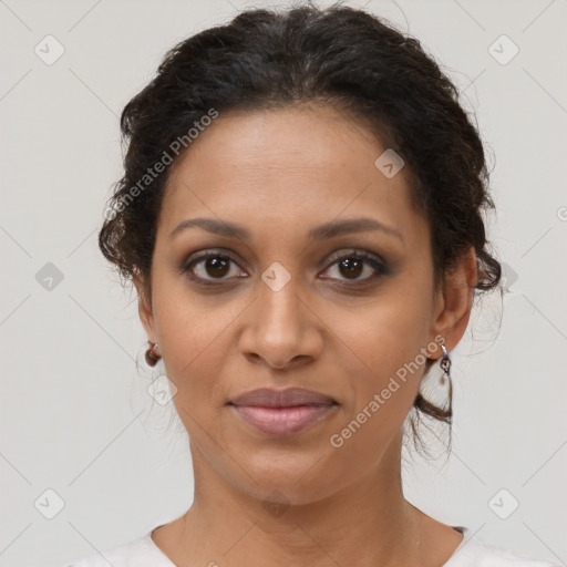 Joyful black young-adult female with medium  brown hair and brown eyes