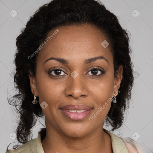 Joyful black young-adult female with long  brown hair and brown eyes
