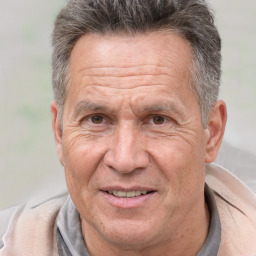 Joyful white middle-aged male with short  brown hair and brown eyes