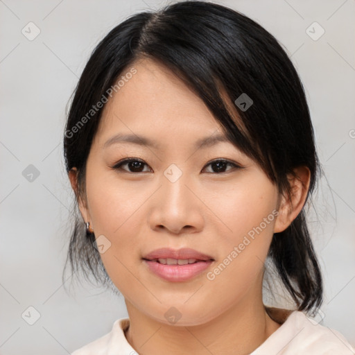 Joyful asian young-adult female with medium  black hair and brown eyes