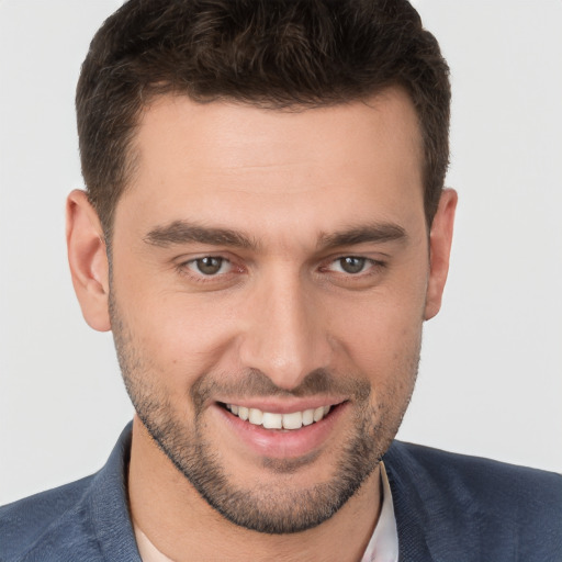 Joyful white young-adult male with short  brown hair and brown eyes