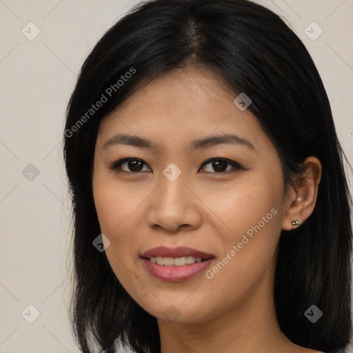 Joyful asian young-adult female with long  brown hair and brown eyes