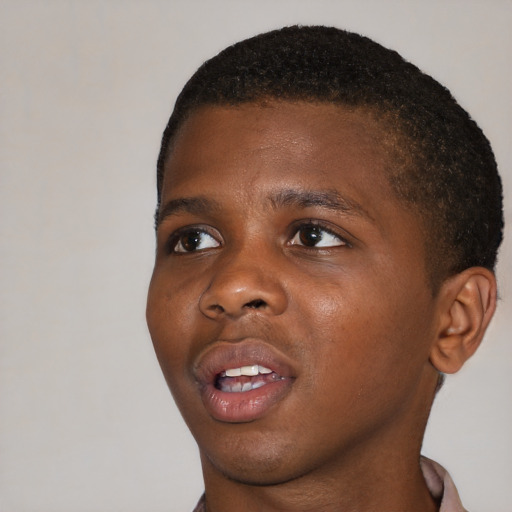 Joyful black young-adult male with short  brown hair and brown eyes