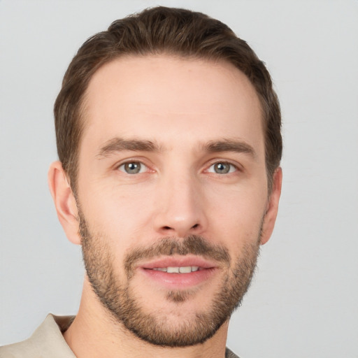 Joyful white young-adult male with short  brown hair and brown eyes