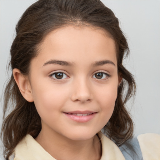 Joyful white child female with medium  brown hair and brown eyes