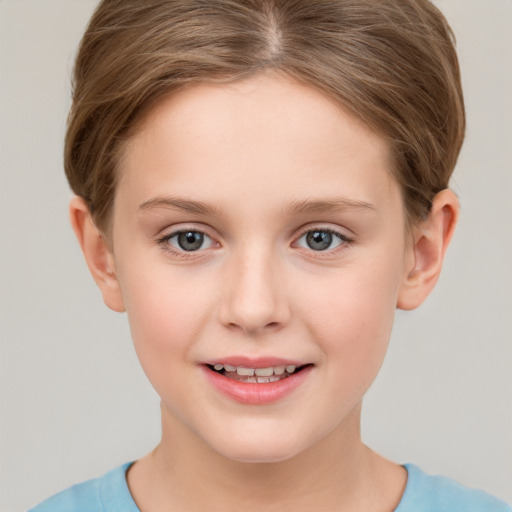 Joyful white child female with short  brown hair and grey eyes