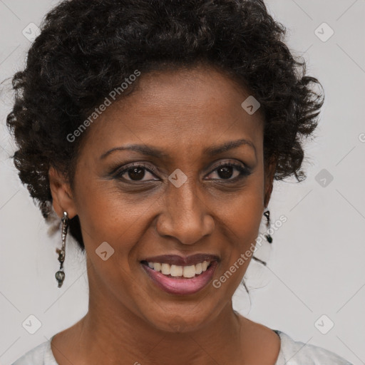 Joyful black adult female with short  brown hair and brown eyes