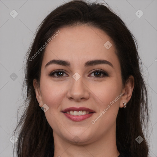 Joyful white young-adult female with long  brown hair and brown eyes