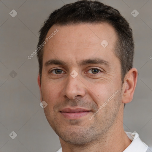 Joyful white adult male with short  brown hair and brown eyes