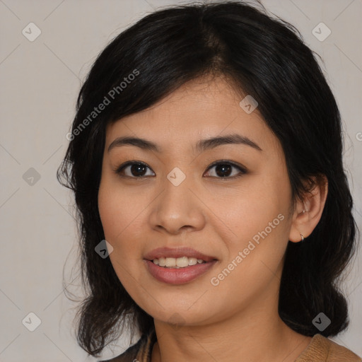 Joyful asian young-adult female with medium  black hair and brown eyes