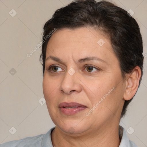 Joyful white adult female with short  brown hair and brown eyes