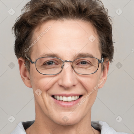 Joyful white adult female with short  brown hair and grey eyes