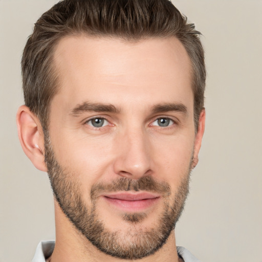 Joyful white young-adult male with short  brown hair and brown eyes