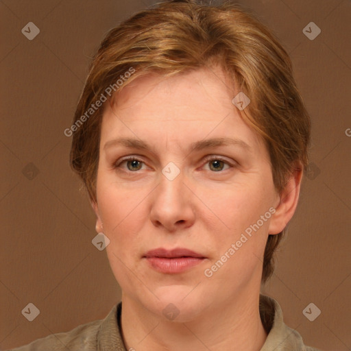 Joyful white adult female with short  brown hair and brown eyes