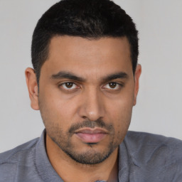 Neutral latino young-adult male with short  black hair and brown eyes