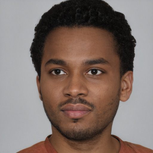 Neutral latino young-adult male with short  brown hair and brown eyes