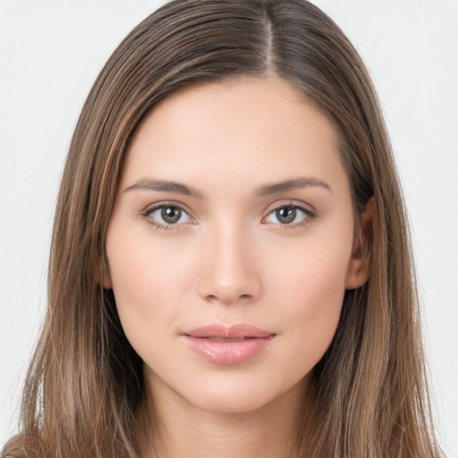 Neutral white young-adult female with long  brown hair and brown eyes