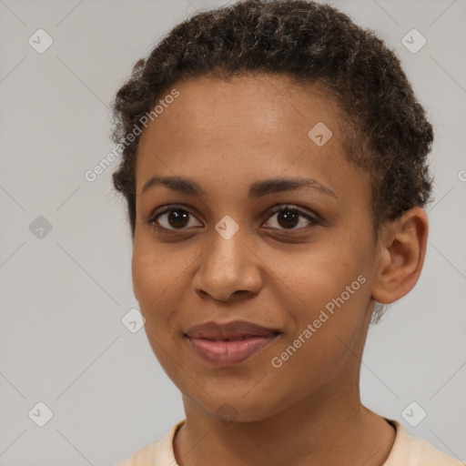 Joyful black young-adult female with short  brown hair and brown eyes