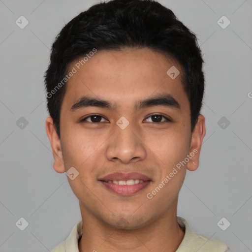 Joyful latino young-adult male with short  black hair and brown eyes