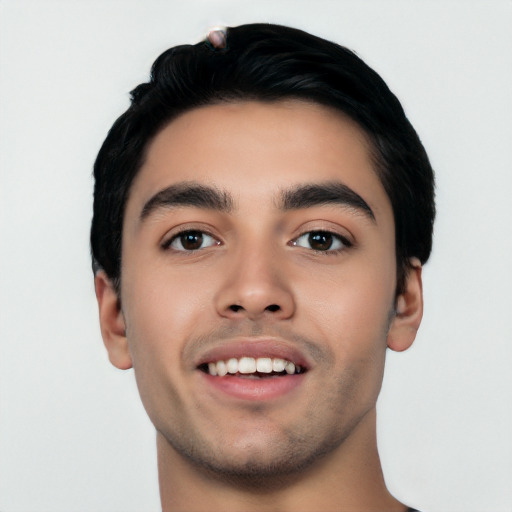 Joyful white young-adult male with short  black hair and brown eyes