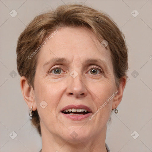 Joyful white adult female with medium  brown hair and grey eyes