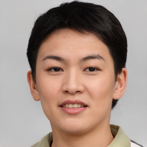 Joyful asian young-adult female with short  brown hair and brown eyes