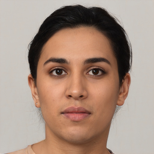 Neutral latino young-adult female with short  black hair and brown eyes