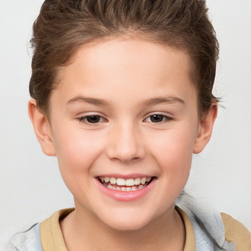 Joyful white child female with short  brown hair and brown eyes