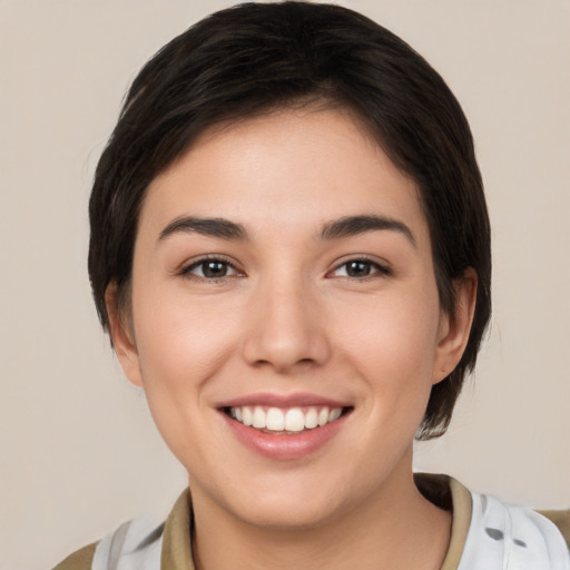 Joyful white young-adult female with short  brown hair and brown eyes