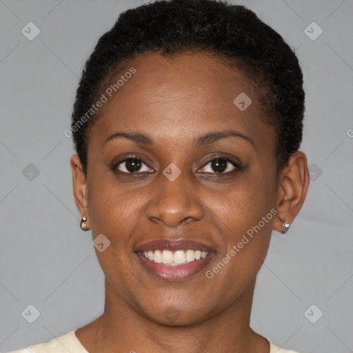 Joyful black young-adult female with short  brown hair and brown eyes