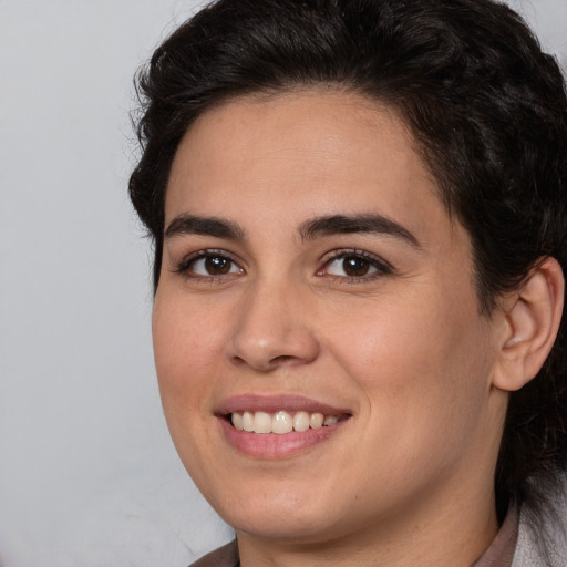 Joyful white young-adult female with medium  brown hair and brown eyes