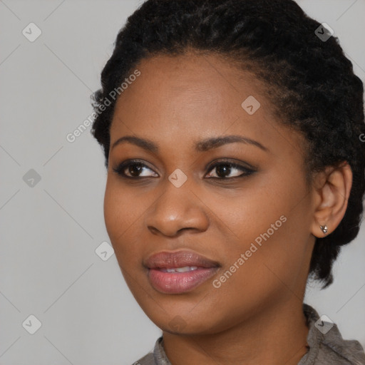 Joyful black young-adult female with short  black hair and brown eyes