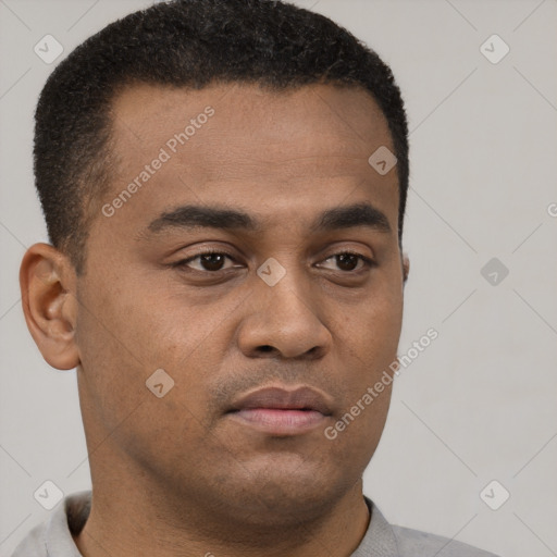 Neutral latino young-adult male with short  brown hair and brown eyes