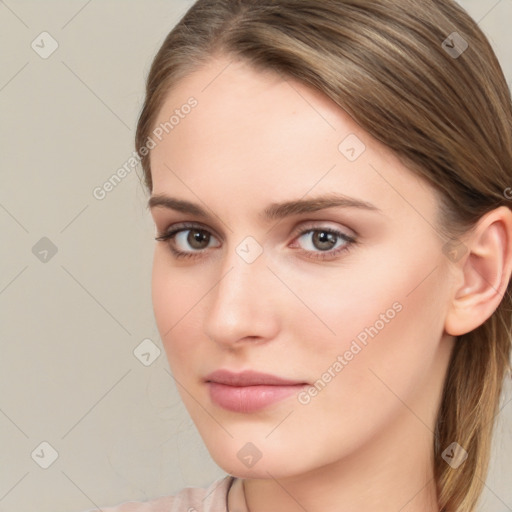 Neutral white young-adult female with long  brown hair and brown eyes