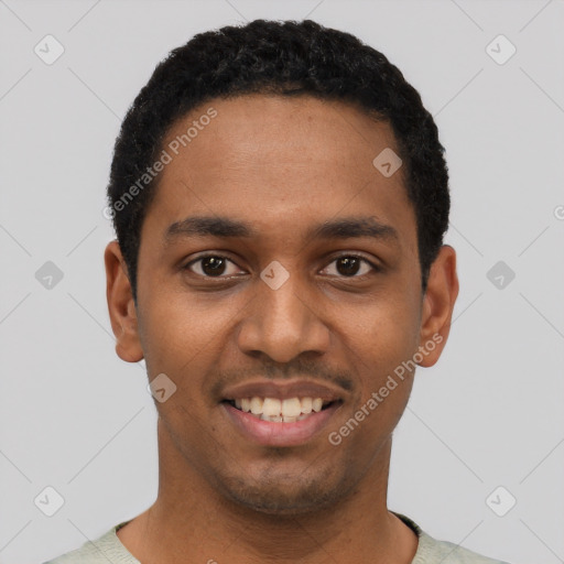 Joyful black young-adult male with short  black hair and brown eyes