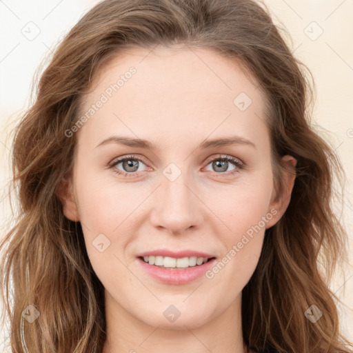 Joyful white young-adult female with long  brown hair and blue eyes