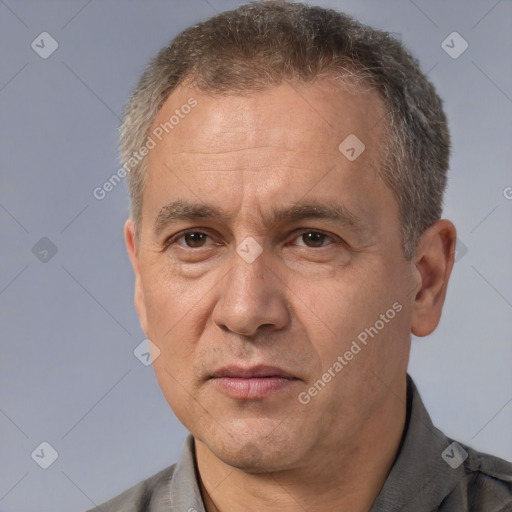 Joyful white middle-aged male with short  brown hair and brown eyes