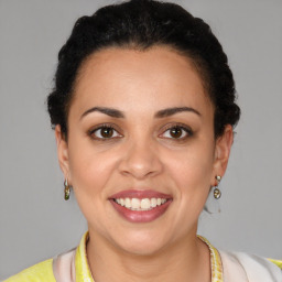 Joyful latino young-adult female with short  brown hair and brown eyes