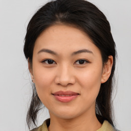 Joyful asian young-adult female with medium  brown hair and brown eyes