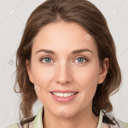 Joyful white young-adult female with medium  brown hair and green eyes