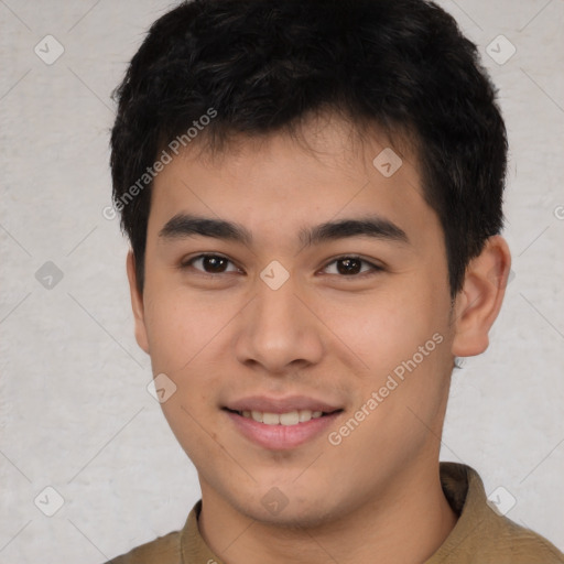 Joyful asian young-adult male with short  brown hair and brown eyes