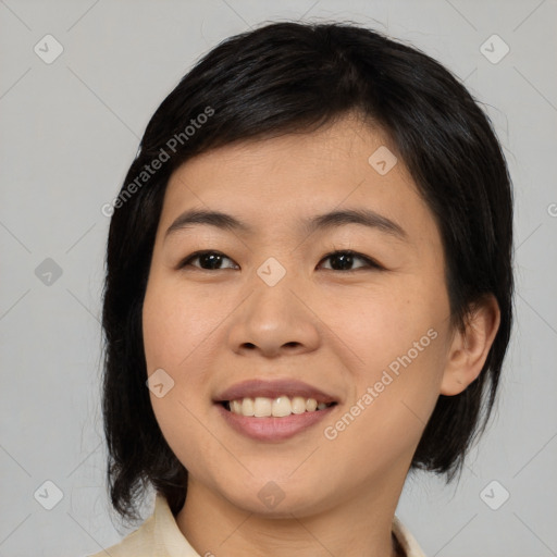 Joyful asian young-adult female with medium  black hair and brown eyes