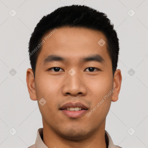 Joyful asian young-adult male with short  black hair and brown eyes