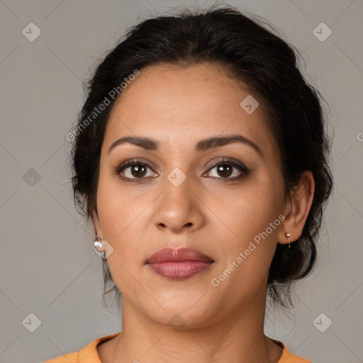 Joyful latino young-adult female with medium  brown hair and brown eyes