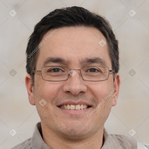 Joyful white adult male with short  brown hair and brown eyes